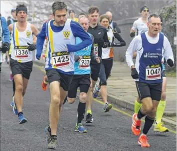  ??  ?? Dave Bowden, of Canterbury Harriers (No.1047) heads this group of runners in the early stages of Sunday’s race