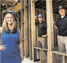  ?? Brett Coomer / Houston Chronicle ?? Carrie Bond, lead sales consultant, and builders Adams Winters and Cole Ballard show a Westview Manor house.