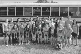  ?? SHELLEY WILLIAMS SPECIAL TO THE ENTERPRISE-LEADER ?? The 2018 Prairie Grove girls soccer team coached by Stephanie Mitchell (right) poses outside the high school before leaving for the State 4A girls soccer tournament in May. Two Lady Tigers were selected to the 4A All-State team.