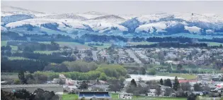  ?? PHOTO: JOHN COSGROVE ?? Snowy sight . . . Balclutha residents woke on September 29 to views of the snowcapped Kaihiku Ranges south of Balclutha. The covering of snow went all the way along the length of the ranges from the south near Clinton to Nugget Pt on the coast. Nugget Pt recorded its lowest ever September temperatur­e of 1.4degC between 11am and noon.