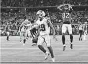  ?? [AP PHOTO] ?? Dallas Cowboys wide receiver Amari Cooper (19) scores the game-winning touchdown against the Philadelph­ia Eagles in overtime on Sunday.