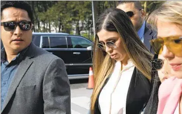  ?? Mark Lennihan Associated Press ?? AN FBI affidavit says Emma Coronel Aispuro, center, seen in Brooklyn in 2019, acted as a “go-between and messenger” for her husband, Mexican drug cartel leader Joaquin “El Chapo” Guzmán, after he was arrested.