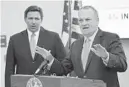  ?? RICARDO RAMIREZ BUXEDA / ORLANDO SENTINEL ?? According to Florida Gov. Ron DeSantis and Education Commission­er Richard Corcoran, eight districts, among them Broward and Palm Beach, violated state“law”by requiring masks in all schools with very strict opt-out provisions.