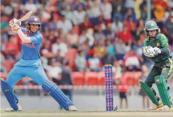  ?? PTI ?? India’s Smriti Mandhana cuts one to the fence against Pakistan during the Women’s Twenty20 Asia Cup at Kuala Lumpur, yesterday. Mandhana scored 38.