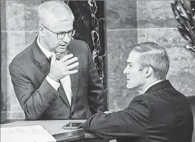 ?? ?? STUN IN THE CHAMBER: Speaker Pro Tempore Rep. Patrick McHenry (left) talks with Rep. Jim Jordan, whose second speaker vote failed Wednesday as Rep. Steve Scalise kept tally (inset).