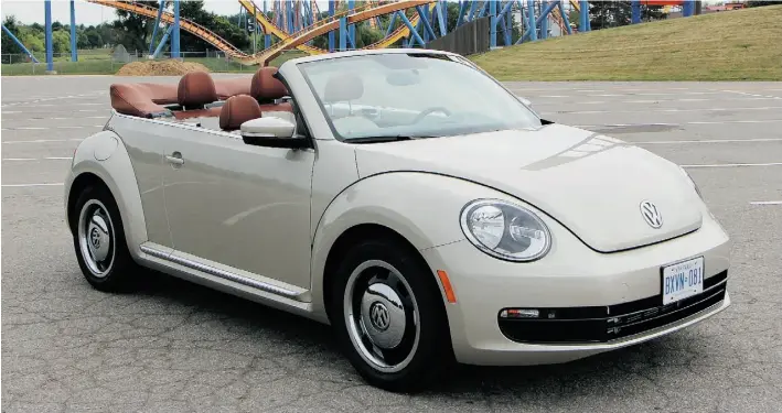  ?? PHOTOS: David Booth
/ Driving ?? With its retro half-moon hubcaps and plaid upholstery, the 2016 Volkswagen Beetle Classic Convertibl­e made David Booth smile but caused Brian Harper to want more power.