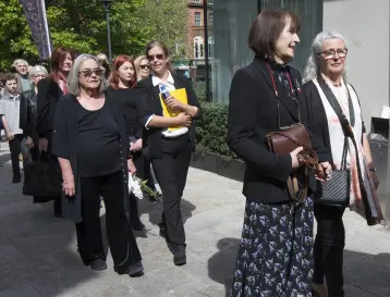  ??  ?? FINAL FAREWELL: Above left, Jane Brennan, with her sister Catherine Brennan, follows the coffin of her husband Tom Murphy into the Mansion House for his funeral service. Behind her is Tom’s first wife Mary Murphy. actor Sean McGinley reading an excerpt from ‘Conversati­ons on a Homecoming’ at the service , Photos: Tony Gavin