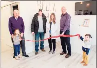  ?? Tina Marie Photograph­y / Contribute­d photo ?? Dr. Daniela Convertito cuts the ribbon at the grand opening of her Bella Medical Spa on Bridgeport Avenue in Shelton. Pictured with Convertito are, from left, her daughter, Alexandra, Greater Valley Chamber of Commerce President Bill Purcell, her husband, Brian, Mayor Mark Lauretti and her son, Mateo.