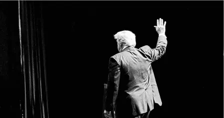  ?? DOUG MILLS THE NEW YORK TIMES ?? U.S. President Donald Trump leaves the stage after addressing the American Farm Bureau Federation’s convention in New Orleans on Monday.