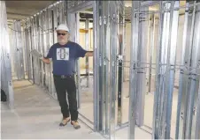  ?? PHOTOS: NICK BRANCACCIO ?? Developer Jim Liovas displays metal studs inside a $20-million housing developmen­t for migrant workers Thursday.