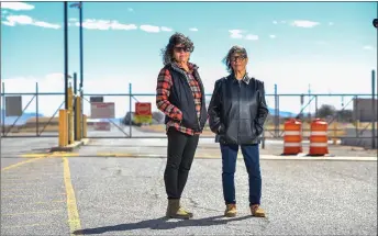  ?? — AFP photos by Valerie Macon ?? Cordova (left) and Louisa Lopez pose for a photo in front of the entrance of White Sands Missile Range where Trinity test site is located, near White Sands, New Mexico.