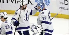  ?? JEFFREY T. BARNES — THE ASSOCIATED PRESS ?? Tampa Bay Lightning goaltender Jonas Johansson (31) and defenseman Victor Hedman (77) celebrate a 3-1 victory overf the Buffalo Sabres following an NHL hockey game Saturday, Jan. 20, 2024, in Buffalo, N.Y.