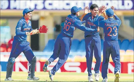  ?? PTI ?? Indian players celebrate the fall of an England wicket during the final of the U19 World Cup in North Sound on Saturday.