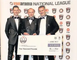  ??  ?? ●●Stockport win Community Club of the Year. From left are the Premier League’s Nick Perchard with the club’s Dave Wardle and Andrew Calvert