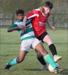  ??  ?? Shadragh Onwubiko (Shamrock Rovers) closing down A.J. Bennett of St. Leonards.