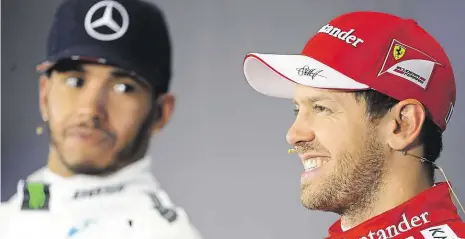  ?? Foto: ČTK ?? Sebastian Vettel z Ferrari (vpravo) se stal mistrem světa čtyřikrát (2010–13), Lewis Hamilton z Mercedesu třikrát (2008, 2014-15).