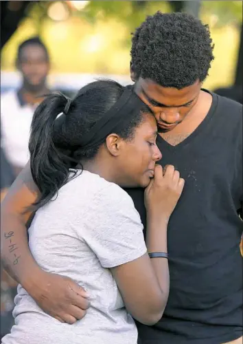  ?? Jay LaPrete/Associated Press ?? Members of Tyre King’s family console each other during a vigil Thursday in Columbus for the 13-year-old shot and killed by Columbus police Wednesday evening.