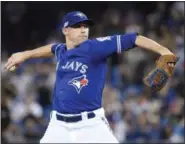  ?? NATHAN DENETTE — THE CANADIAN PRESS VIA THE ASSOCIATED PRESS ?? Blue Jays starting pitcher Aaron Sanchez pitches in the first inning of Tuesday’s game.