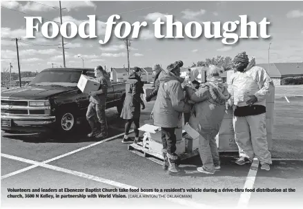  ??  ?? Volunteers and leaders at Ebenezer Baptist Church take food boxes to a resident's vehicle during a drive-thru food distributi­on at the church, 3600 N Kelley, in partnershi­p with World Vision. [CARLA HINTON/ THE OKLAHOMAN]