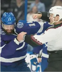  ?? CHRIS OMEARA/AP ?? Tampa Bay Lightning left wing Pat Maroon (14) and Arizona defenseman Josh Brown (3) tangle during the third period Saturday night.