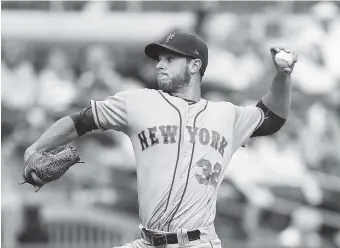  ?? THE ASSOCIATED PRESS ?? New York Mets starting pitcher Steven Matz works in the first inning of Saturday’s game against the Atlanta Braves in Atlanta. It was the second game of a doublehead­er.