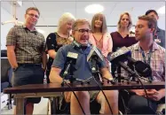  ?? AP PHOTO BY JANIE HAR ?? Plane crash survivor Eric Raptosh sits beside psychologi­st Mark Held, right, at a news conference at Santa Clara Valley Medical Center's Sobrato Rehabilita­tion Center in San Jose, Wednesday, Sept. 5.