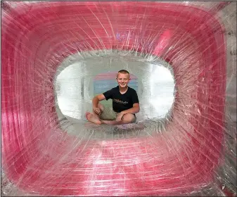  ?? Courtesy Photo ?? Eleven-year-old Collin Siebert helps beta test the “Tape and Tunnels” exhibit, one of three celebratin­g the third birthday of the Scott Family Amazeum.