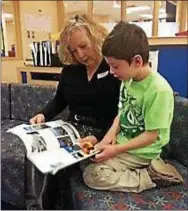  ?? SUBMITTED PHOTO — RSVP ?? Volunteer Carol Rudè reads with her student.