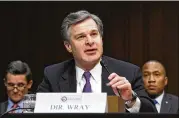  ?? OLIVIER DOULIERY / ABACA PRESS / TNS ?? FBI Director Christophe­r Wray testifies before the Senate Intelligen­ce Committee for a hearing focusing on global threats.