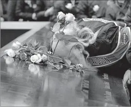  ?? [RICHARD DREW/THE ASSOCIATED PRESS] ?? Ed Schantz, representi­ng Monica Rodriguez Smith and her unborn daughter, two of the six victims of the Feb. 26, 1993, World Trade Center bombing, kisses her name on the 9/11 Memorial during the 25th anniversar­y ceremony in New York.