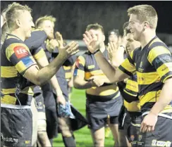  ??  ?? Canterbury’s players savour the feeling that comes with getting over the line for the first time in National League 1