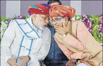  ?? PTI ?? PM Narendra Modi and MP CM Shivraj Singh Chouhan in Rajgarh on Saturday. >>P8