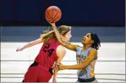  ?? ASSOCIATED PRESS ?? Wright State’s Angel Baker scores two of her 23 points Tuesday after a steal against IUPUI in the fourth quarter of the Horizon League Tournament championsh­ip game in Indianapol­is.