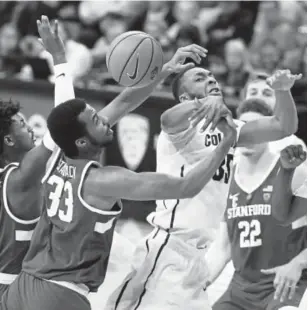  ?? David Zalubowski, The Associated Press ?? Colorado’s Dallas Walton and Stanford’s Trevor Stanback battle for a rebound Sunday at the Coors Events Center. The Buffs improved to 15-10.