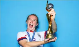  ?? Photograph: Naomi Baker/ Fifa/Getty Images ?? Sam Mewis holds the Women’s World Cup after the US victory in France in 2019. The midfielder has joined Manchester City for the new WSL season.