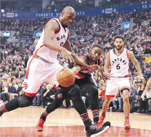  ?? FRANK GUNN / THE CANADIAN PRESS ?? Raptors forward and recent acquisitio­n Serge Ibaka strips the ball from Portland Trail Blazers forward