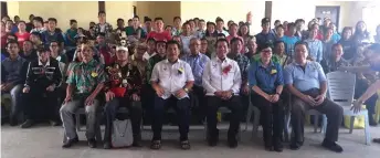  ??  ?? (Seated front from le ) Jangin, Juwin, Baru, Dennis, Lo and Salang in a photo call with participan­ts, community leaders and agencies that made the programme at the Rural Service Centre in Long Latei a success.