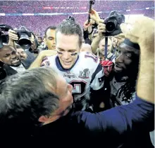  ?? KEVIN C. COX/GETTY ?? Head coach Bill Belichick and quarterbac­k Tom Brady celebrate after their New England Patriots defeated the Atlanta Falcons to win Super Bowl 51 on Sunday in Houston, Texas.