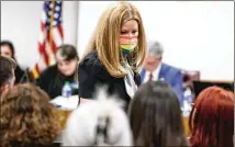  ?? NATRICE MILLER/NATRICE.MILLER@AJC.COM ?? Jen Slipakoff of Cobb County, mother of a transgende­r daughter, returns to her seat Wednesday in Atlanta after speaking against Senate Bill 140, which would restrict transgende­r treatment for children.
