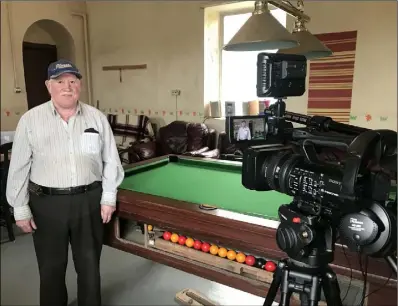  ??  ?? Tony Casey being filmed at Enniscorth­y Men’s Shed.