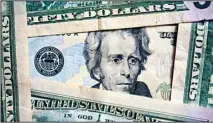  ?? ?? Photo of Andrew Jackson on a $20 bill is shown, Jan. 28, 2022, in Cleveland. Inflation is at a 40-year high. Stock prices are sinking. The Federal Reserve is making borrowing much costlier. (AP)