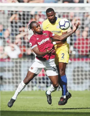  ?? Reuters ?? West Ham’s Michail Antonio fights for the ball with Chelsea’s Antonio Rudiger (right) during a Premier League match at the London Stadium yesterday.