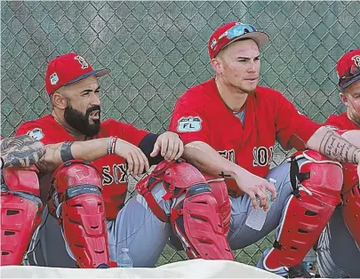  ?? STAFF HOTO BY MATT STONE ?? BACKSTOPS: Sandy Leon (left) will likely be the Sox starting catcher on Opening Day, but Christian Vazquez is still in the picture.