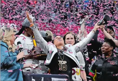  ?? MORRY GASH/AP PHOTO ?? South Carolina head coach Dawn Staley celebrates after the NCAA women’s basketball tournament championsh­ip game against Iowa on Sunday in Cleveland.