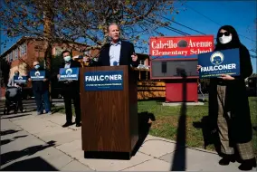  ?? AP PHOTO BY JAE C. HONG ?? Former San Diego Mayor Kevin Faulconer, center, speaks during a news conference on Tuesday, Feb. 2, 2021, in the San Pedro section of Los Angeles. Faulconer announced Monday he is entering the race for California governor, the first major Republican to formally step into the contest while a potential recall election aimed at Democratic Gov. Gavin Newsom moves closer to qualifying for the ballot this year.