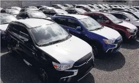  ?? PHOTOS BY LIONEL ROOKWOOD/PHOTOGRAPH­ER ?? Vehicles on the lot at Stewart’s Automotive Group’s new bonded warehouse on Arnold Road in Kingston.