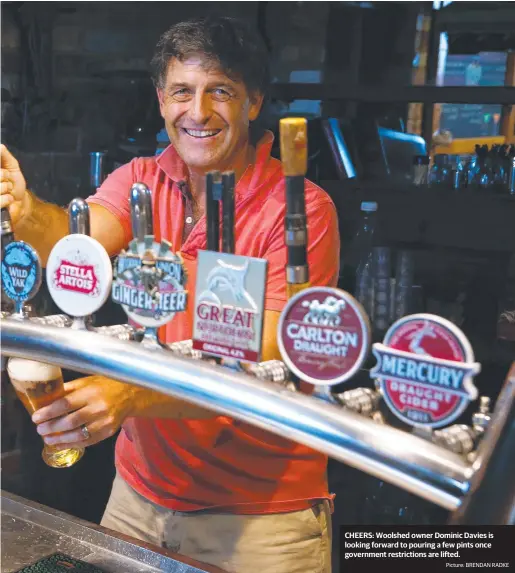  ?? Picture: BRENDAN RADKE ?? CHEERS: Woolshed owner Dominic Davies is looking forward to pouring a few pints once government restrictio­ns are lifted.