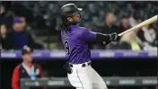  ?? DAVID ZALUBOWSKI – THE ASSOCIATED PRESS ?? Colorado Rockies first baseman Connor Joe bats in a game in May.