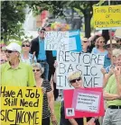  ?? BILL HODGINS KAWARTHA LAKES THIS WEEK ?? More than 100 protest at a rally at Lindsay’s Victoria Park last month over the province’s decision to end the Basic Income Project.