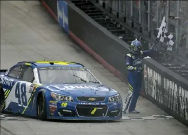  ?? ANDRE TEAGUE — THE ASSOCIATED PRESS ?? Jimmie Johnson celebrates his win in the Food City 500 at Bristol Motor Speedway in Bristol, Tenn. on Monday.